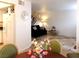 Open-concept living room boasts neutral walls, tile flooring, and staircase access at 6412 Big Pine Way, Las Vegas, NV 89108