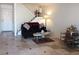 A cozy living room with tiled floors, a staircase and a decorative doorway at 6412 Big Pine Way, Las Vegas, NV 89108