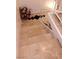 Tiled staircase with white railings and dark accents at 6412 Big Pine Way, Las Vegas, NV 89108