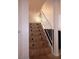 Tiled staircase with white railings leading to the upper floor at 6412 Big Pine Way, Las Vegas, NV 89108