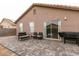Backyard featuring a paved patio, seating area, and easy access through sliding glass doors at 652 Carlos Julio Ave, North Las Vegas, NV 89031