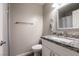 Bathroom featuring a white vanity with granite countertop and a toilet at 652 Carlos Julio Ave, North Las Vegas, NV 89031
