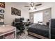 Bedroom showcasing a bed, desk and ceiling fan at 652 Carlos Julio Ave, North Las Vegas, NV 89031