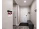 Clean foyer with a bench, decorative hooks, and a stylish, neutral color scheme at 652 Carlos Julio Ave, North Las Vegas, NV 89031