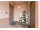 Charming front porch with a decorative display of potted plants and home decor at 652 Carlos Julio Ave, North Las Vegas, NV 89031