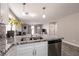 Kitchen island with granite countertop, sink, and stainless steel dishwasher at 652 Carlos Julio Ave, North Las Vegas, NV 89031