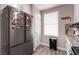 Kitchen showcasing stainless steel refrigerator and granite countertops at 652 Carlos Julio Ave, North Las Vegas, NV 89031