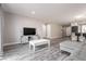 Open-concept living space with views of the kitchen and gray plank flooring at 652 Carlos Julio Ave, North Las Vegas, NV 89031