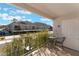 Charming covered balcony featuring outdoor furniture with mountain views at 6800 E Lake Mead Blvd # 2091, Las Vegas, NV 89156