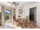 Cozy dining area with a glass table, two chairs, and access to the balcony with mountain views at 6800 E Lake Mead Blvd # 2091, Las Vegas, NV 89156