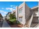 Exterior view of the building showing the stairs and stucco facade on a sunny day at 6800 E Lake Mead Blvd # 2091, Las Vegas, NV 89156