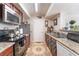 Galley kitchen with stainless steel appliances, granite countertops and lots of cabinet space at 6800 E Lake Mead Blvd # 2091, Las Vegas, NV 89156
