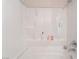 Clean white tub-shower combo featuring shelving for bath and shower essentials at 6800 E Lake Mead Blvd # 2091, Las Vegas, NV 89156