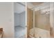 Modern bath with shower featuring neutral tile and a clear glass enclosure, providing a refreshing bathing experience at 7300 Pirates Cove Rd # 2087, Las Vegas, NV 89145