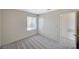 Bedroom featuring carpet, a window, and an entrance to another room at 7300 Pirates Cove Rd # 2087, Las Vegas, NV 89145