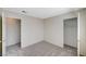 Spacious bedroom featuring two doors with neutral colored walls and carpet at 7300 Pirates Cove Rd # 2087, Las Vegas, NV 89145