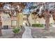 Inviting condominium complex with manicured landscaping and mature trees surrounding the building at 7300 Pirates Cove Rd # 2087, Las Vegas, NV 89145