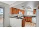 Well-equipped kitchen with granite countertops and modern appliances, including white dishwasher at 7300 Pirates Cove Rd # 2087, Las Vegas, NV 89145