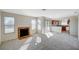 Spacious living room featuring fireplace, sliding glass doors, and an open kitchen at 7300 Pirates Cove Rd # 2087, Las Vegas, NV 89145