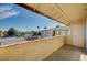 Exterior balcony view overlooking the community tennis courts and neighboring building at 7300 Pirates Cove Rd # 2087, Las Vegas, NV 89145