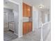 Upstairs hallway featuring built-in storage cabinets with bathroom entryway at 744 Spruce Tree Cir, Henderson, NV 89014