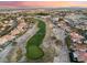 Gorgeous aerial view overlooking the golf course and luxury homes in a beautiful Las Vegas community at 7608 Painted Dunes Dr, Las Vegas, NV 89149