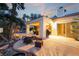 Backyard with fire pit, outdoor seating, and covered patio, perfect for entertaining, near sliding glass doors at 7608 Painted Dunes Dr, Las Vegas, NV 89149