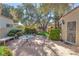 Cozy backyard with patio, dining table, manicured plants and shade trees perfect for relaxation at 7608 Painted Dunes Dr, Las Vegas, NV 89149