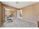 Bedroom featuring mirrored closets, neutral paint, and gray carpeting at 7608 Painted Dunes Dr, Las Vegas, NV 89149