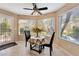 Cozy breakfast nook with lots of natural light and views of the garden at 7608 Painted Dunes Dr, Las Vegas, NV 89149
