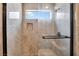 Shower with a rainfall showerhead, handheld sprayer, and sleek black hardware at 7608 Painted Dunes Dr, Las Vegas, NV 89149