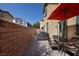 Outdoor patio area with dining set and grill, perfect for outdoor dining at 7731 Ornamento Way, Las Vegas, NV 89179