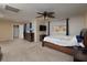 Spacious bedroom with large bed, dresser, and a mounted TV at 7731 Ornamento Way, Las Vegas, NV 89179