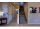 Inviting foyer with staircase, tile flooring, and neutral wall color scheme at 7731 Ornamento Way, Las Vegas, NV 89179