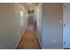 Hallway with wood-style floors and lots of natural light at 7731 Ornamento Way, Las Vegas, NV 89179