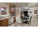 Eat-in kitchen with stainless steel appliances and sliding glass door at 7731 Ornamento Way, Las Vegas, NV 89179
