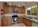 Kitchen with stainless steel appliances, granite countertops, and recessed lighting at 7731 Ornamento Way, Las Vegas, NV 89179