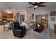 Open-concept living space with dining area and access to the backyard patio at 7731 Ornamento Way, Las Vegas, NV 89179