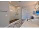 Well-lit bathroom featuring a walk-in shower and soaking tub perfect for relaxing at 7966 W Ford Ave, Las Vegas, NV 89113