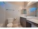 Modern bathroom featuring vanity with white countertop, toilet and combined tub and shower with gray tile at 7966 W Ford Ave, Las Vegas, NV 89113