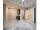 Open room featuring tile flooring, and bar area leading to a bathroom with glass shower and toilet at 7966 W Ford Ave, Las Vegas, NV 89113