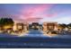 Stunning single-story home with modern desert landscaping and excellent curb appeal under a lovely sunset at 7966 W Ford Ave, Las Vegas, NV 89113