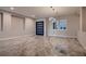 Bright open floorplan with recessed lighting, stylish light fixture, and large format tile flooring at 7966 W Ford Ave, Las Vegas, NV 89113