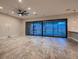 Open-concept living room with large sliding glass doors leading to backyard pool and outdoor area at 7966 W Ford Ave, Las Vegas, NV 89113