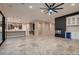 Spacious living room features a modern fireplace, a built-in bar, and seamless access to the kitchen at 7966 W Ford Ave, Las Vegas, NV 89113