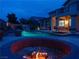Beautiful backyard showcasing a pool, spa, fire pit, and patio area for outdoor enjoyment at 8070 Pavarotti Ave, Las Vegas, NV 89178