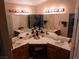 Bathroom vanity with dual sinks, ample counter space, a large mirror, and a vanity area at 8070 Pavarotti Ave, Las Vegas, NV 89178