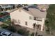 Two-story stucco home with solar panels, balcony, tile roof, landscaped yard and backyard swimming pool at 8070 Pavarotti Ave, Las Vegas, NV 89178