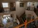 Grand foyer with staircase, wrought iron railing, and view of the dining and living spaces at 8070 Pavarotti Ave, Las Vegas, NV 89178