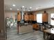 Spacious kitchen featuring custom cabinets, stainless steel appliances, and a central island at 8070 Pavarotti Ave, Las Vegas, NV 89178
